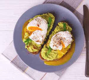 Guacamole On Toast With Poached Egg On Top