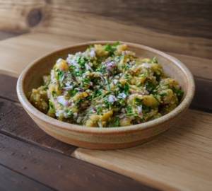 Baingan Bharta in green chilli no tadka.