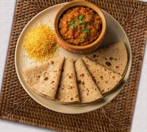 Sev tamatar with 5 butta roti