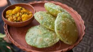 Matar Shutir Kochuri With Aloo Dom