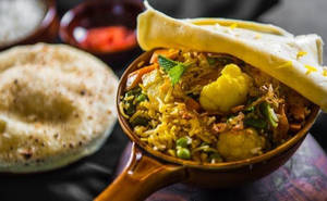 Veg Dum Biryani Served Raita & Salad