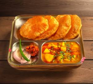 Potato gravy sabzi and five poori