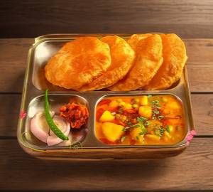 Potato peas tomato gravy sabzi and five poori