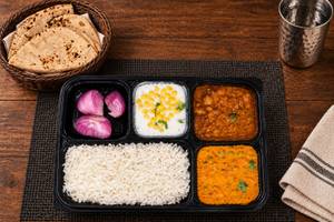 Chole, Matar Paneer, Tawa Roti (4), Rice, Salad & Raita thalis