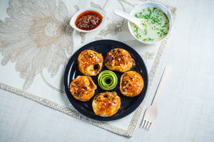 Veg and cheese momo pan fry in schezwan sauce