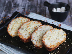 Garlic Bread With Veggie Toppings And Cheese