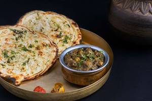 .Chhole Bhuna and Tandoori Kulcha Thali.