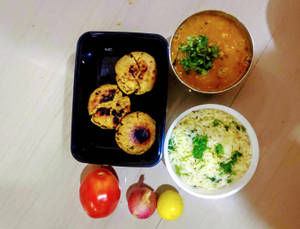 Butter Tadka Dal (500 Ml) +  Masala Bati (3 Pieces) +  Salad +  Jeera Rice (200 Grams)