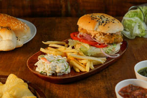 Hot And Crispy Paneer Burger With Fries