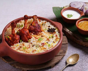 CHICKEN HYDERABADI DUM BIRYANI WITH 1  LOLLIPOP - HALF
