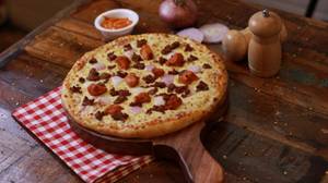 Medium Mixed Grill Pizza.