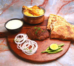 2Pc Shami Kebab + 2Pc Paratha + Half Chicken Biryani