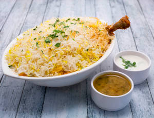 Murg Dum Biryani (1 Ltr) + Papad + Raita