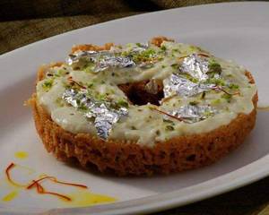 Ghewar Sprinkled With Dollops Of Malai Kalakand 1pc