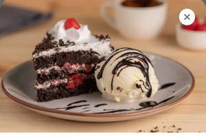 Black Forest Cake With Ice  Cream And Chocolate Sauce