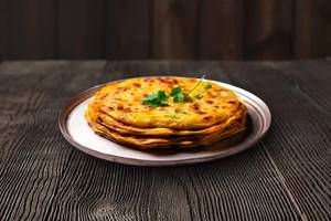 2 Schezwan Aloo Paratha & Dahi [100 ml]