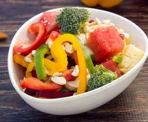 Veggie salad with fruit and nuts
