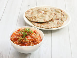 Bajra Rotis & Sev Tamatar Sabzi
