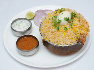 Rayala Vari Chicken Dum Biryani [served with raita & salan]