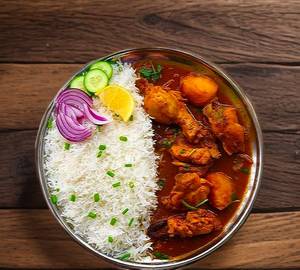 Chicken chawal with delicious chutney or salad 