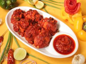 Schezwan Tossed Chicken Momos