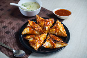 Corn and cheese momo pan fry in korean sauce