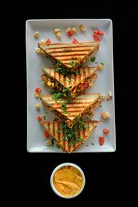 Red Pepper Hummus And Corn Sandwich