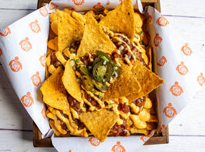 Cheesy Nachos With Chipotle Chicken & Jalapeno