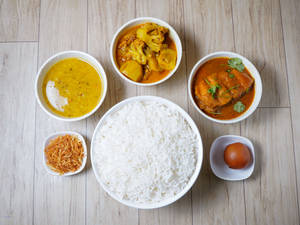 Basmati Steamed Rice + Moog Dal + Jhuri Aloo Bhaja + Sabji Rui Kaalia (1Pc) + Sweet (Serves 1)                