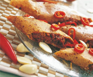 Schezwan Dosa With Cheese