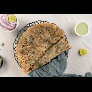 Paneer Pyaz Mix Parantha Served With Curd, Chutney And Achaar