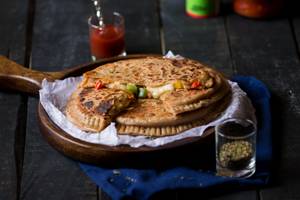 Cheesy Paneer Pizza Paratha(1 Pc)