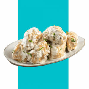 Momos In Cheese Sauce