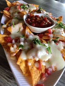 Nachos In Cheese Sauce And Salsa Dip