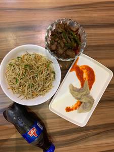 Momos (2 Pcs) , Vegetable Fried Rice/Veg Chow , Chilli Beef and A 200 ml Pepsi  Combo      