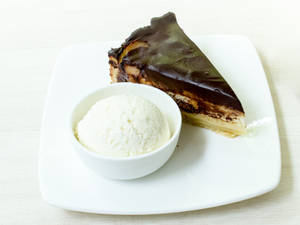 Pear And Chocolate Cake Slice With One Scoop Vanilla