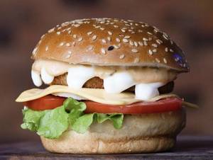 Veg Cheese Burger + Cheese Garlic Bread + Fries + Mocktails