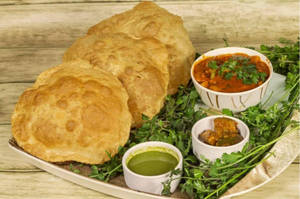 4 Plain Atta Puri With  Choice Of Aloo Sabji Or  Channa Sabji