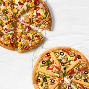 Super Value Deal : 2 Medium Veg Pizzas starting at Rs 649 (Save Upto 44%)