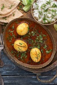 Egg Curry (2 Pcs) + Tawa Roti (4 Pcs) + Jeera Rice + Salad