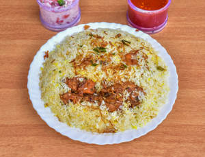 Chicken Biryani (1 Pc)  [ served with raita & Pickle ]
