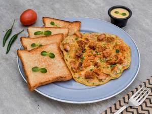 Chicken Tikka Omelet With Toasted Bread and Home Cheese Sauce