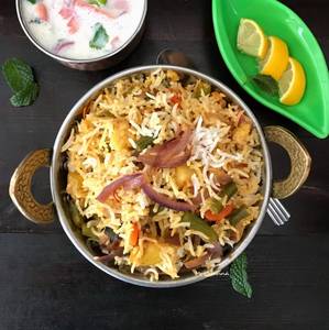 Vegetable Dum Biryani With Raita With (Onion Garlic)