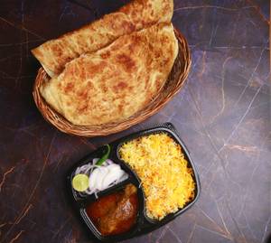 1 Pc Chicken Masala + Biryani Rice + 2 Pcs Paratha + Salad + Raita