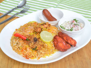 Chicken Biryani Combo (Chicken biryani Served with 2pcs kebab, raita and Gulab Jamun.)