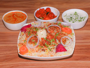 Mutton Special Biryani(served with 1 Boiled egg, Chicken 65 (half), Mirchi-ka-salan, Raita, Salad)