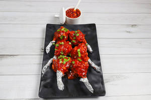 Chicken Lollipop Tossed In Schezwan Sauce