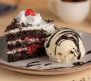 Black Forest Cake With Ice Cream And Chocolate Sauce 