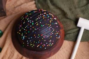 Round Dark Truffle Pinata Cake