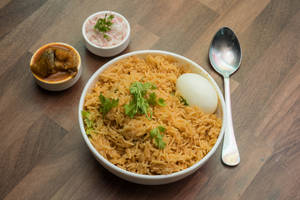 Egg Biryani (serves with raita)